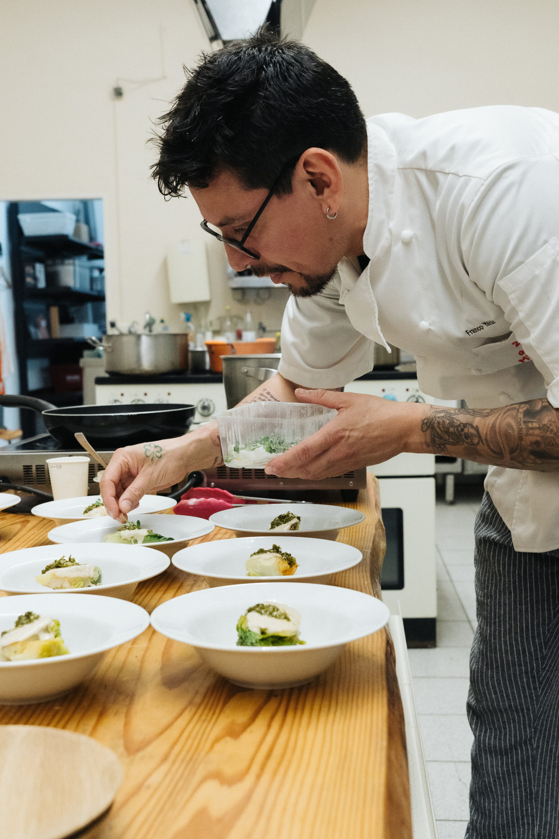 Chef plating dishes in the kitchen