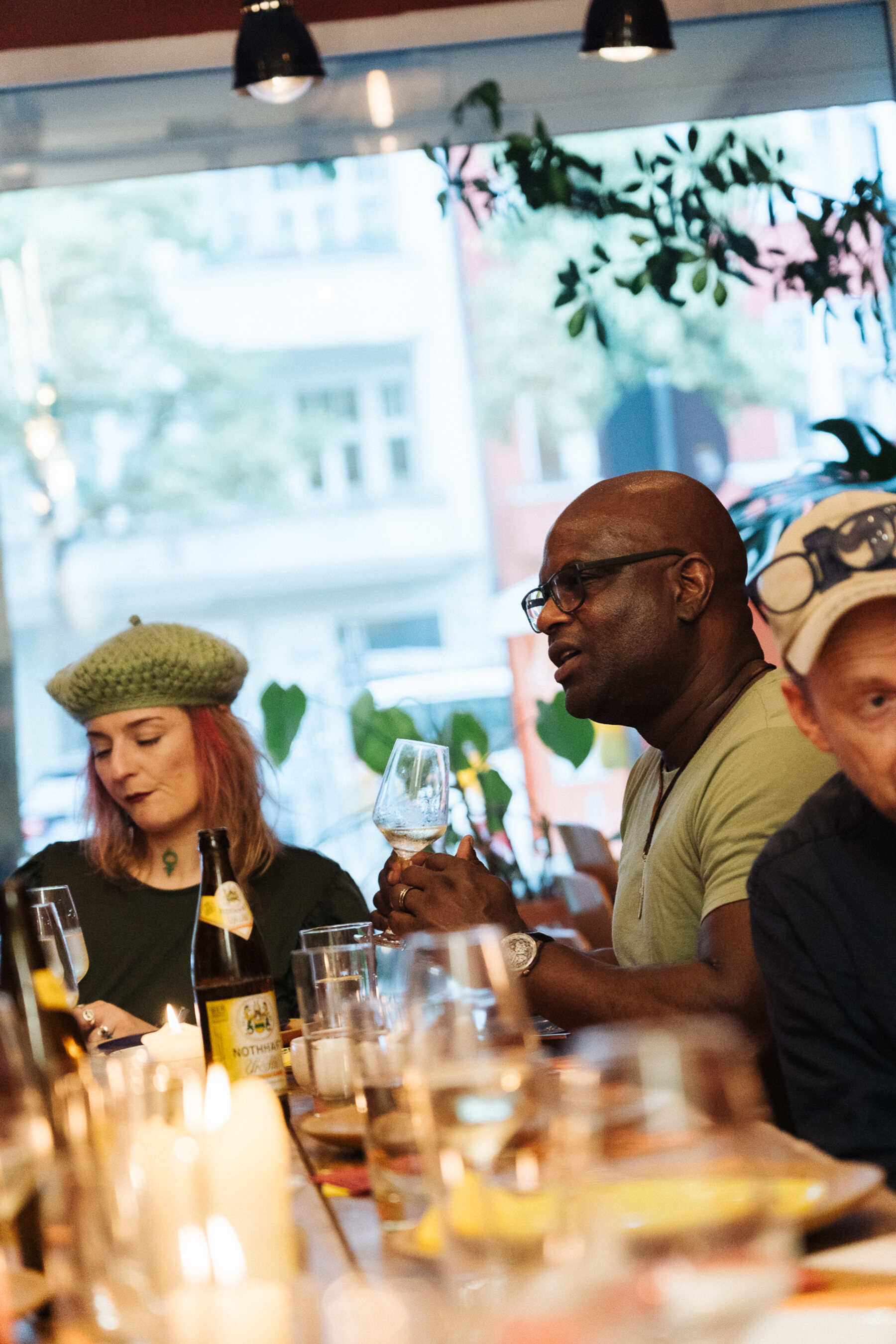 Guests sharing a festive Tacos Berlin dinner