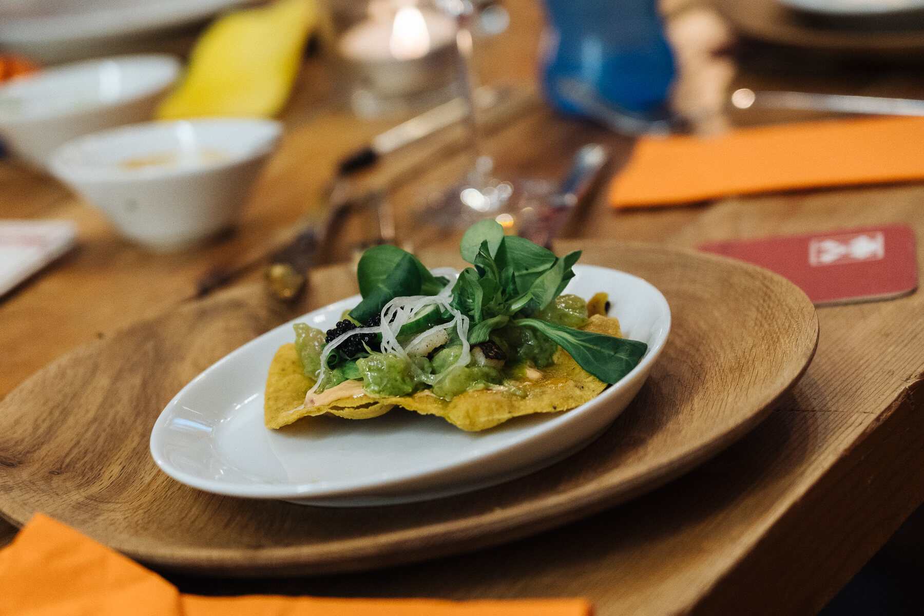 Open quesadilla with guacamole and fresh herbs